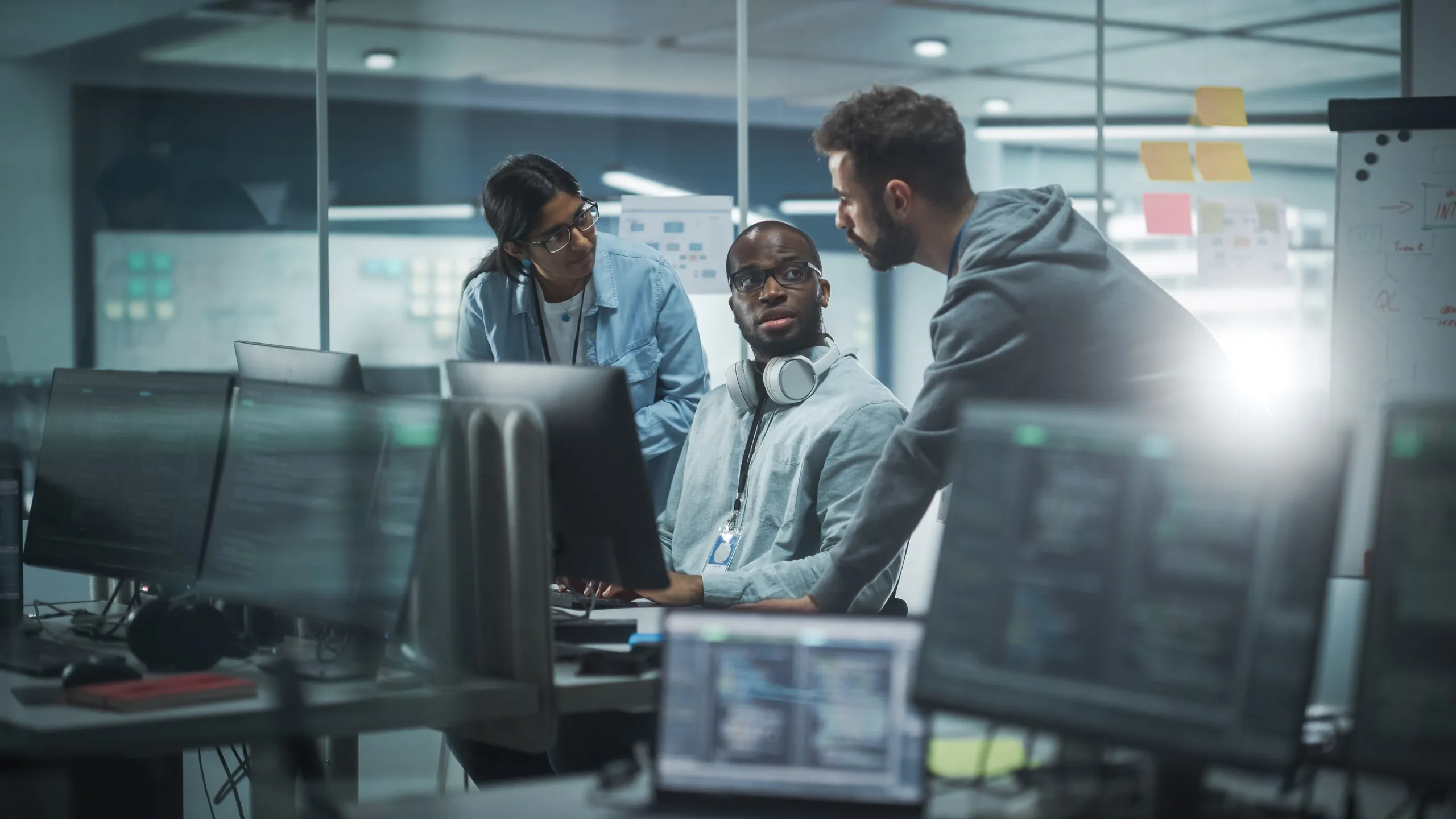 a group of people in a conference room, engaged in a collaborative effort